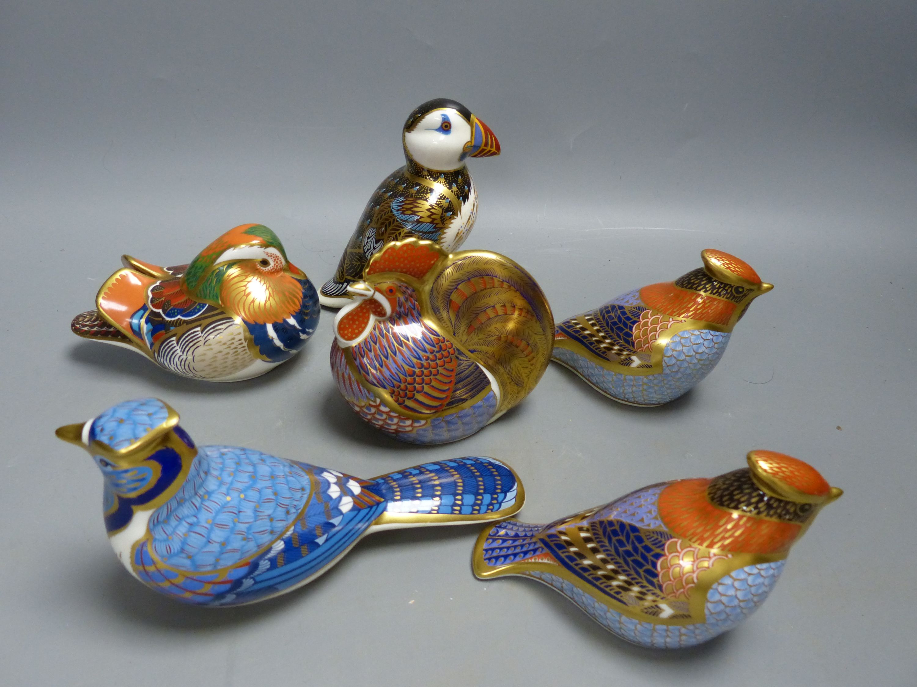 Six Royal Crown Derby Imari pattern paperweights with silver stoppers,